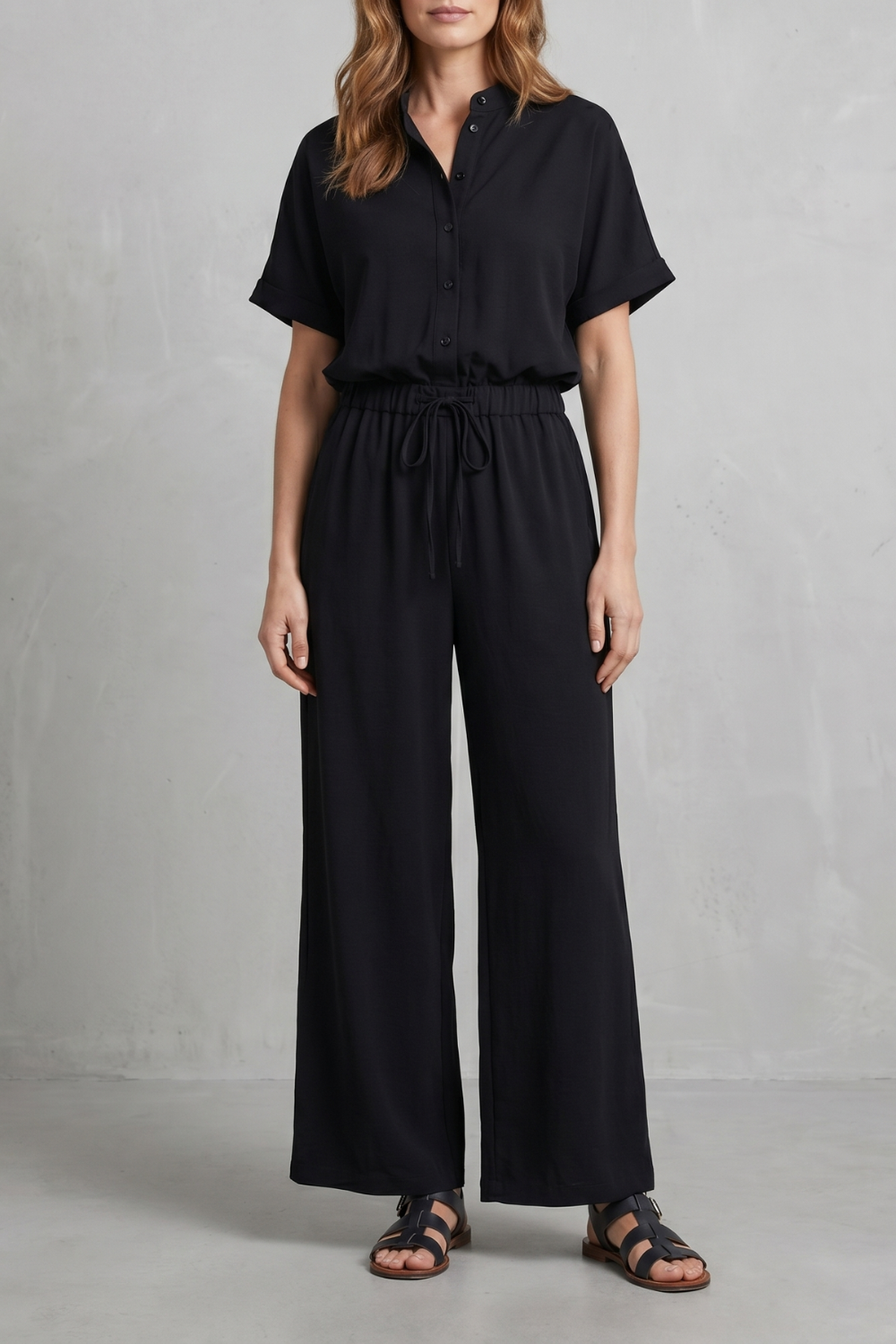 Detail of the elasticated waistband on the wide-leg pants