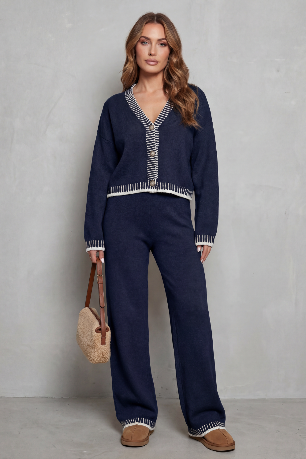 Knit lounge set styled with sneakers and layered necklaces