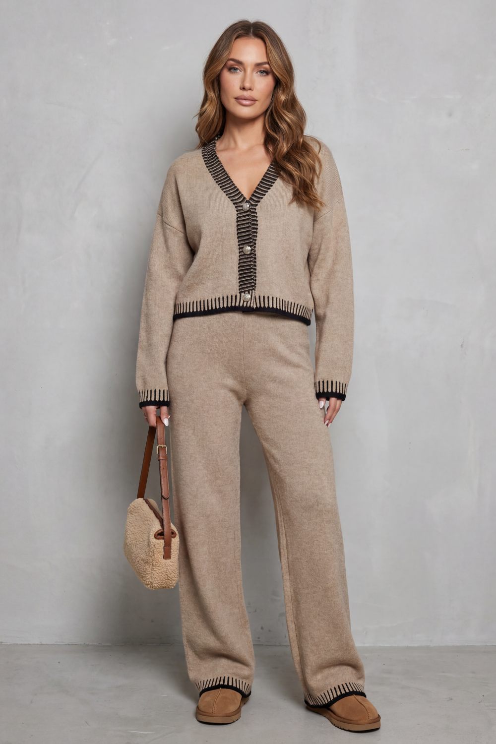 Side view of the cropped knit cardigan and wide-leg pants