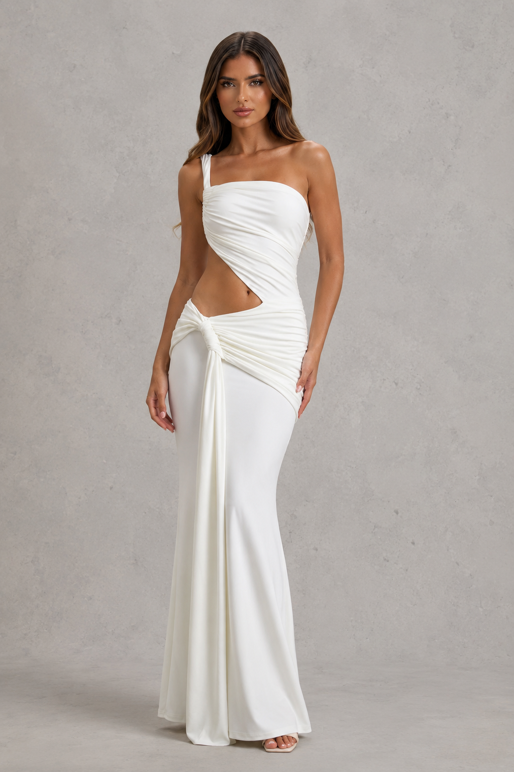 Women’s asymmetric cut-out jersey maxi dress with sculptural neckline, fitted silhouette and elegant wrap-style floor-length skirt.
