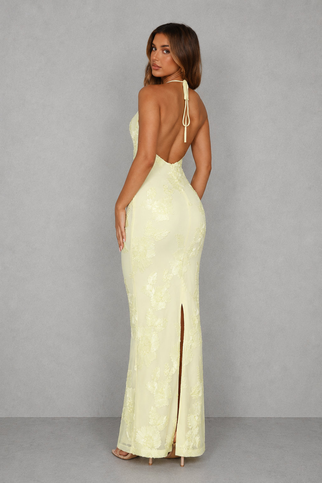 Women’s halter backless maxi dress with a scooped neckline, adjustable self-tie straps, fitted silhouette, and elegant high back split.