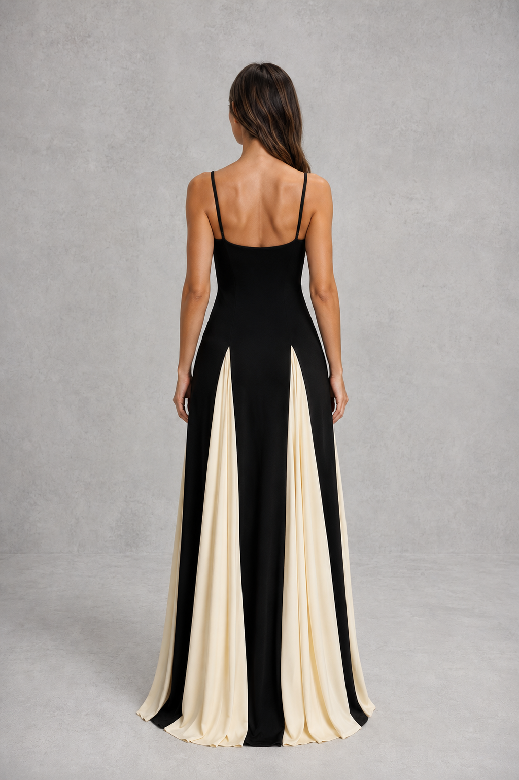 Women’s two-tone maxi dress with sculpted fitted bodice, adjustable shoulder straps and flowing contrast skirt for elegant occasion wear.