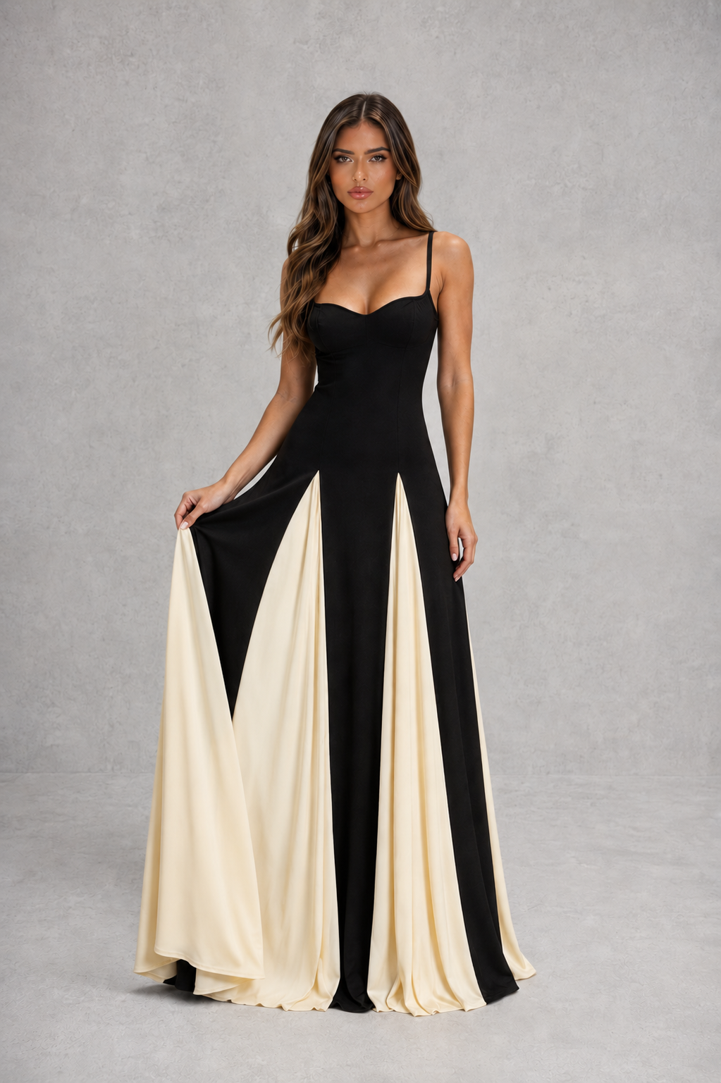 Women’s two-tone maxi dress with sculpted fitted bodice, adjustable shoulder straps and flowing contrast skirt for elegant occasion wear.