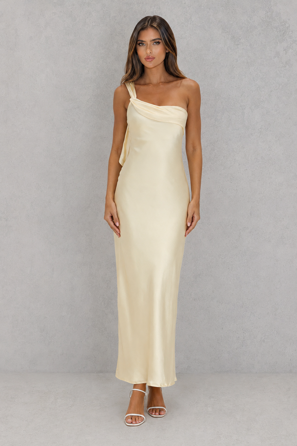 Women’s one-shoulder satin maxi dress with a flowing silhouette and statement ruffle detail along the back shoulder strap.