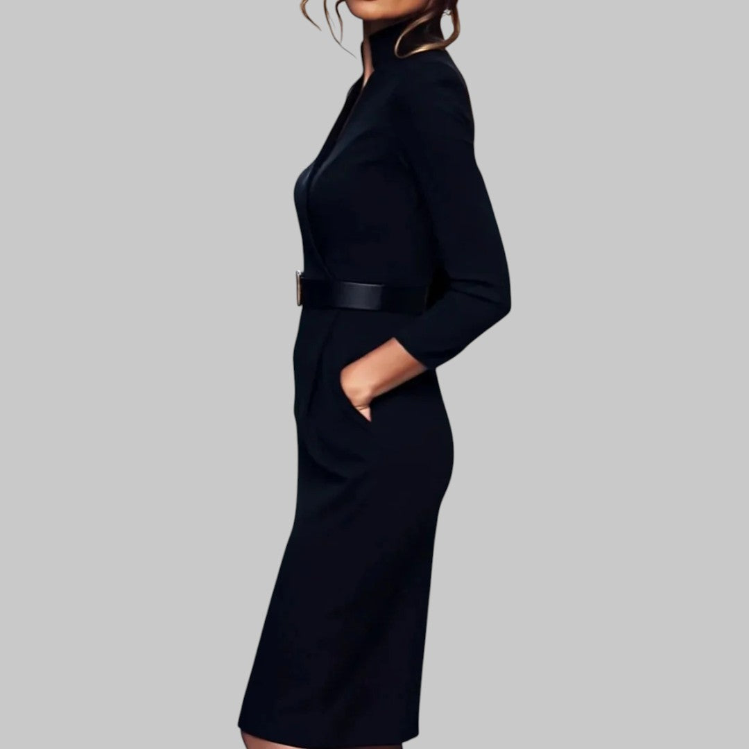 Woman wearing the Klyne Studios Structured Sheath Midi Dress featuring a fitted silhouette, structured collar, cinched waist belt, and midi-length design in premium structured fabric.