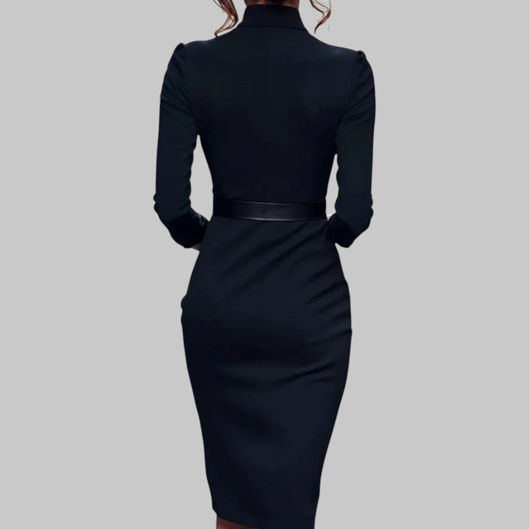 Woman wearing the Klyne Studios Structured Sheath Midi Dress featuring a fitted silhouette, structured collar, cinched waist belt, and midi-length design in premium structured fabric.
