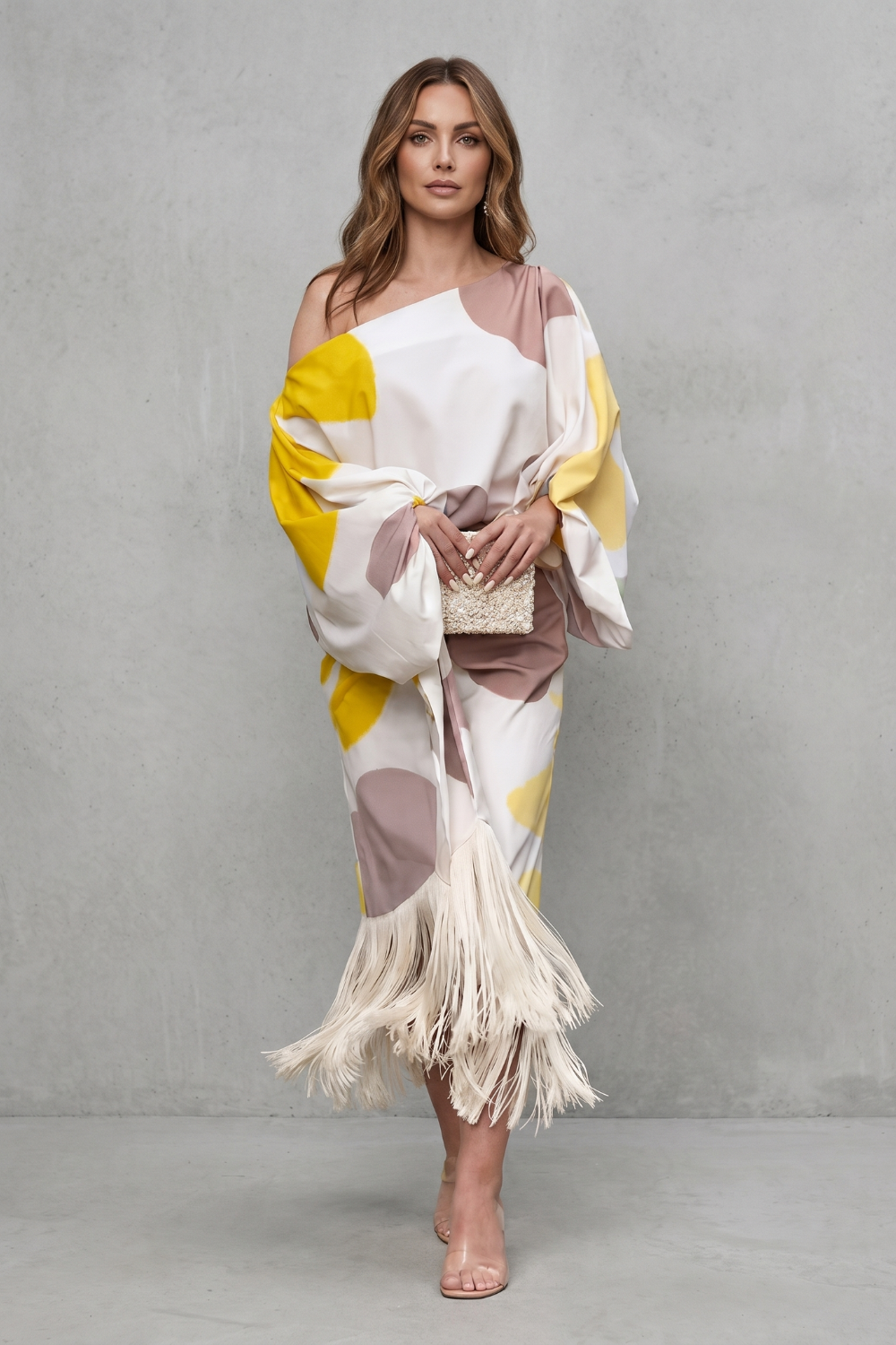 Side view of the off-shoulder draped top and abstract print two-piece set