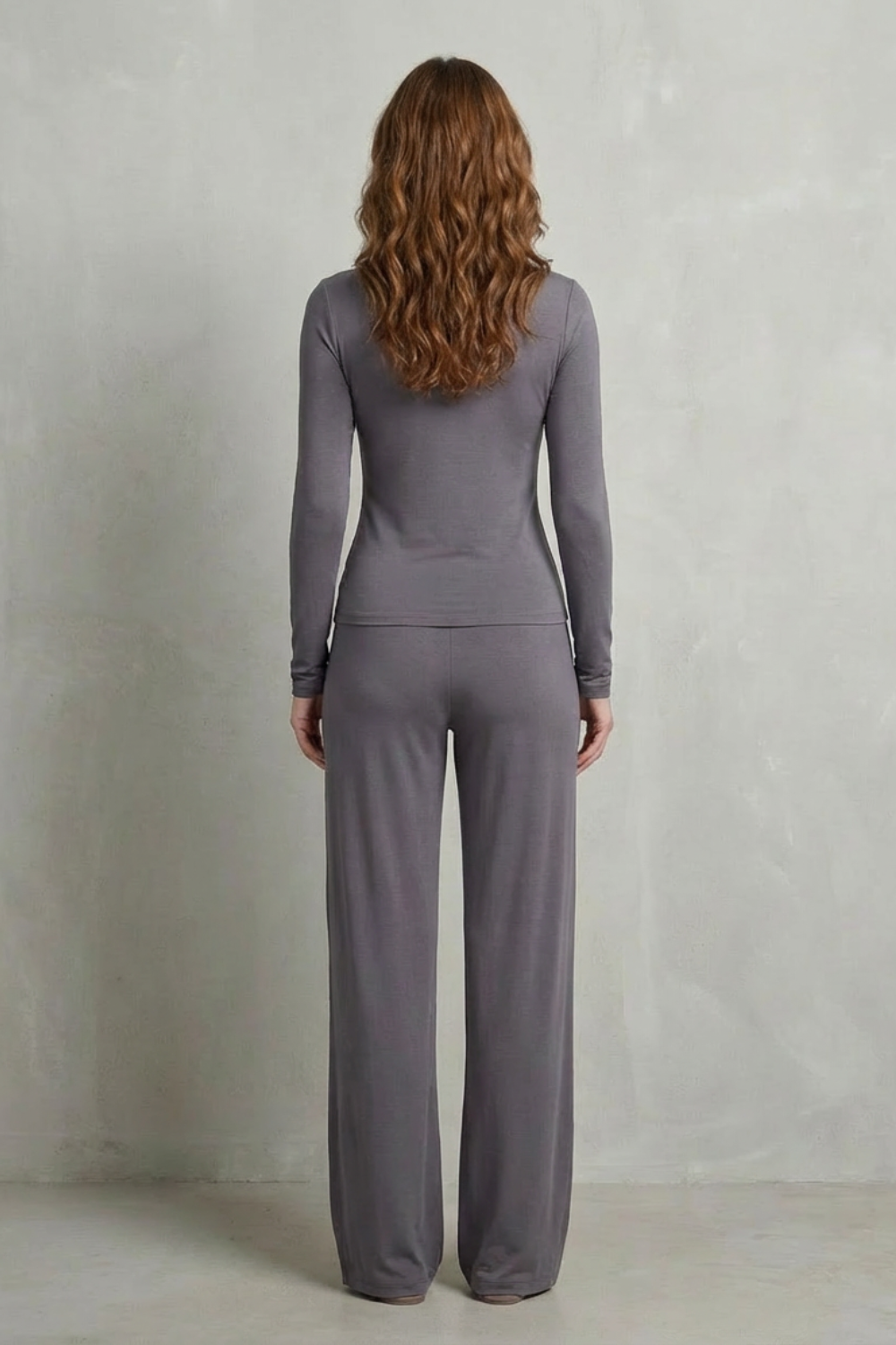 Detail close-up of the stretchy ruched waist on the knit top