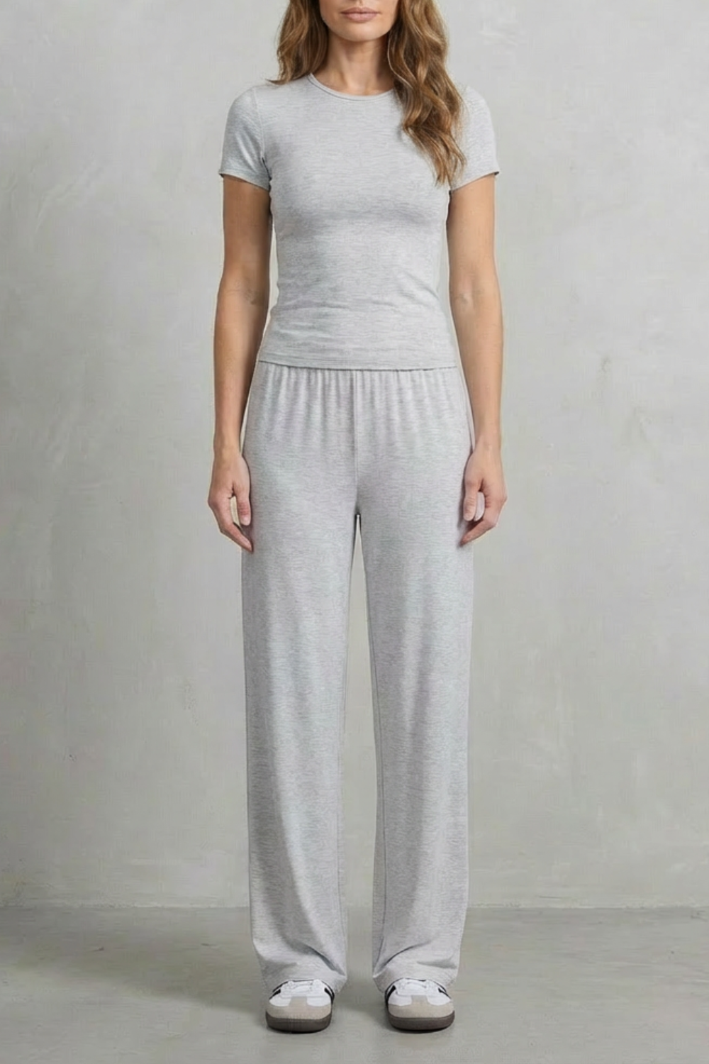 Full-length view showing the elongated knit silhouette