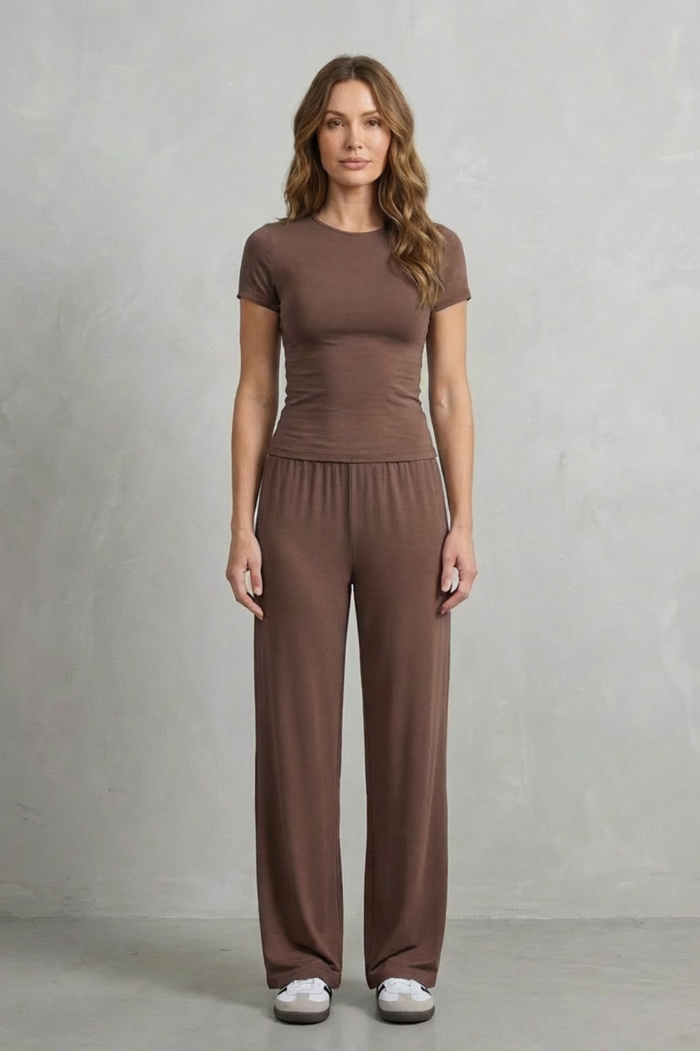 Drape detail of the flowy wide-leg knit pants