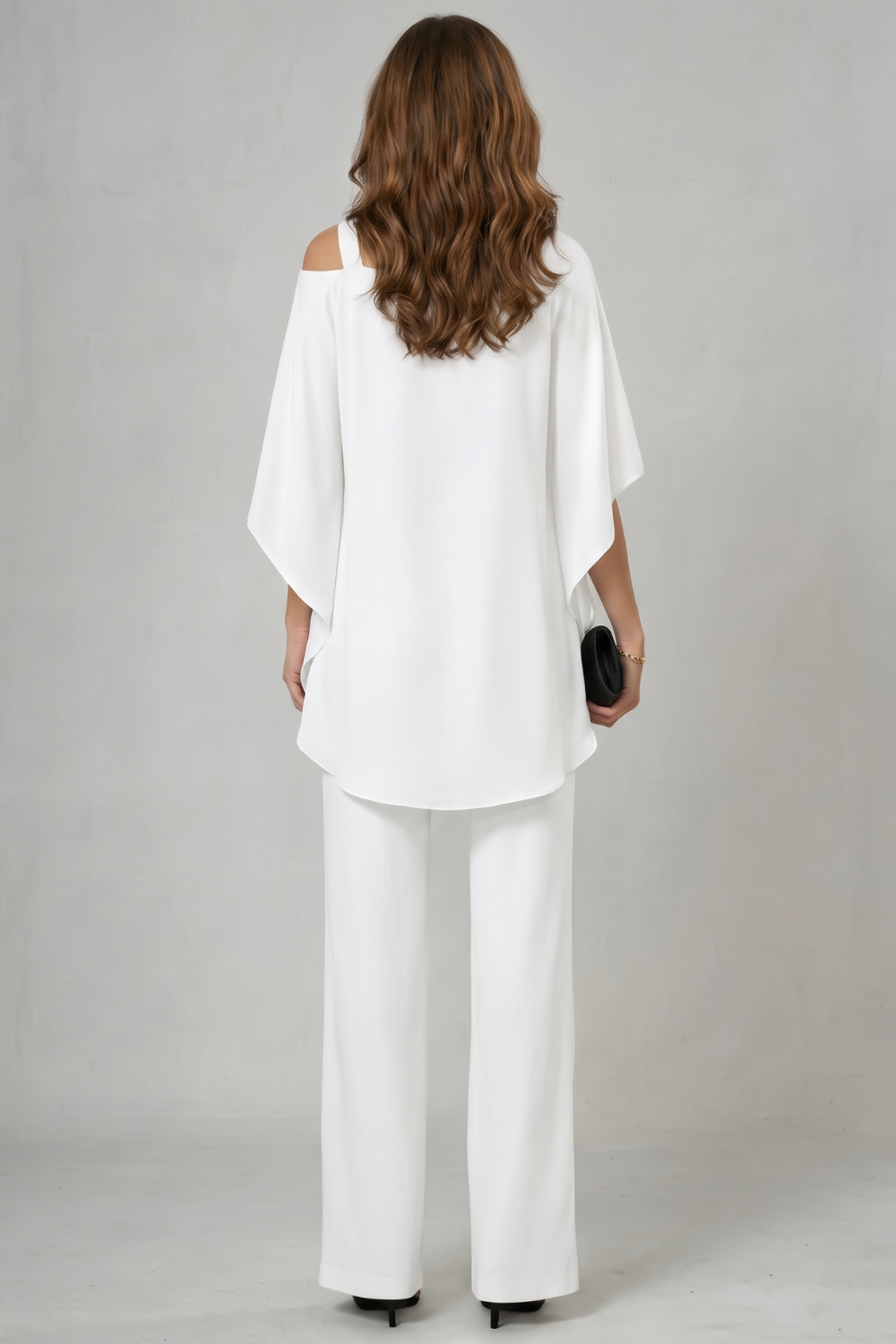 Detail close-up of the off-shoulder asymmetric neckline