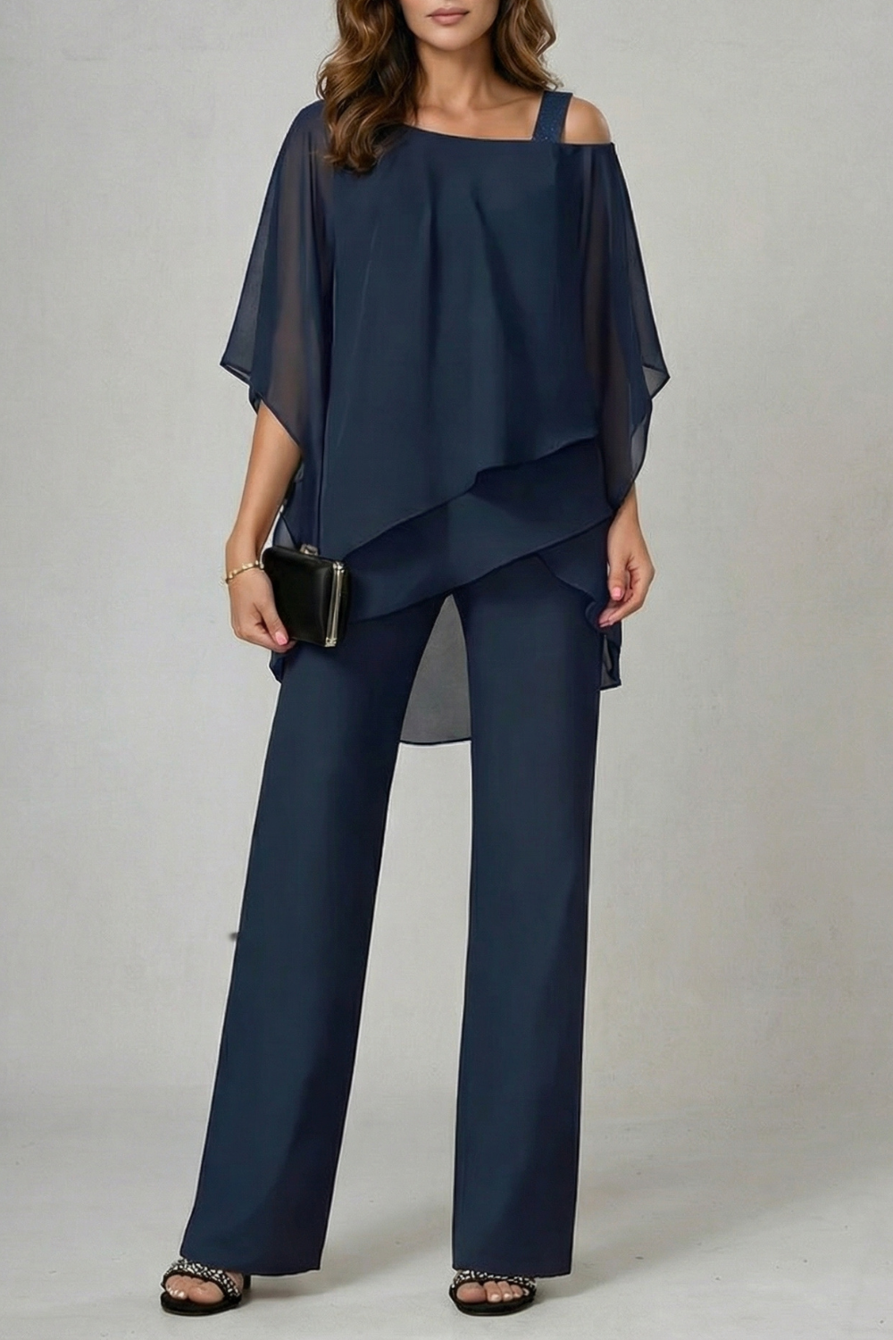 Detail of the wide-leg pant hem and fluid chiffon drape