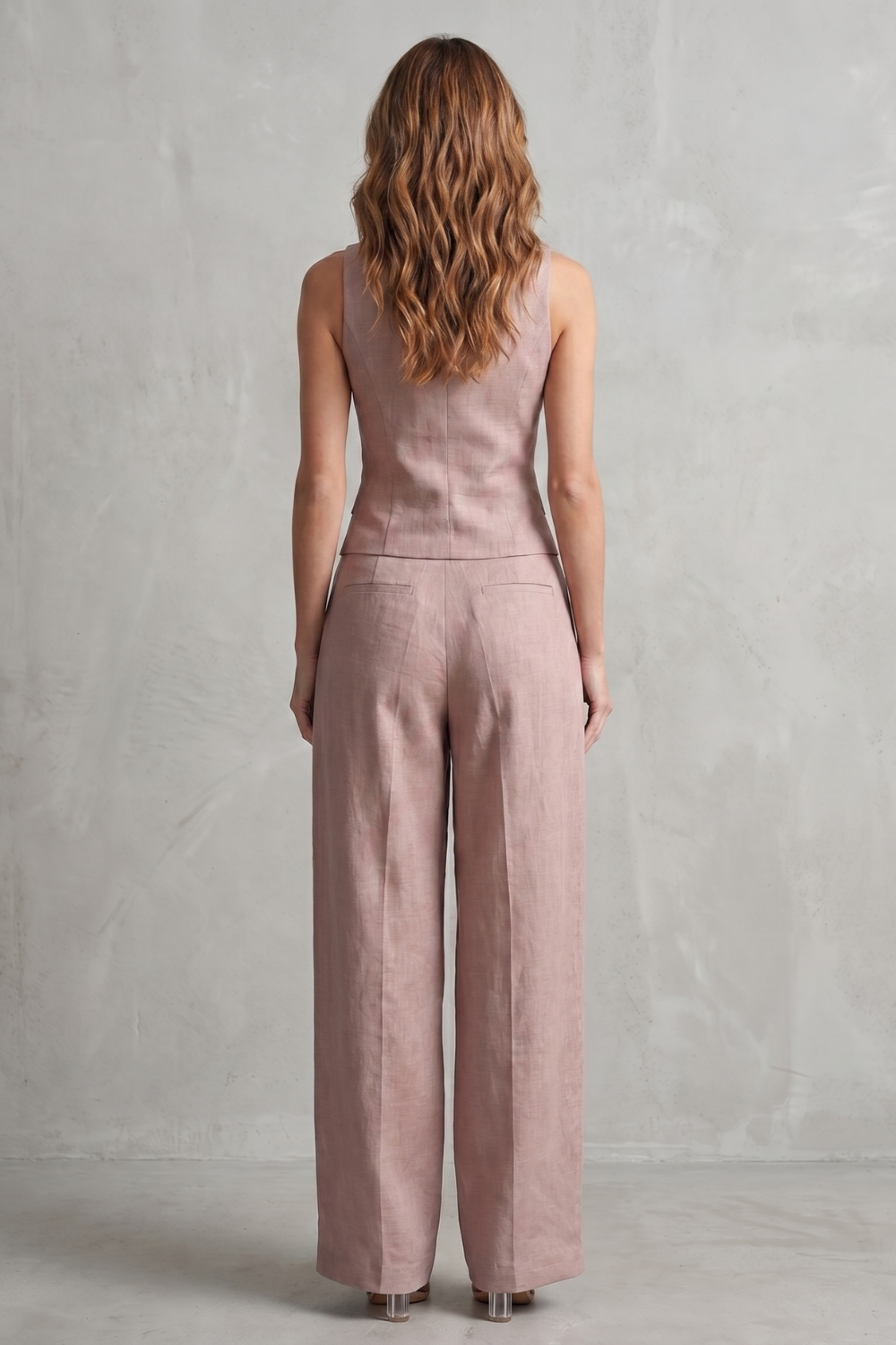 Detail close-up of the button-front placket and V-neckline on the vest