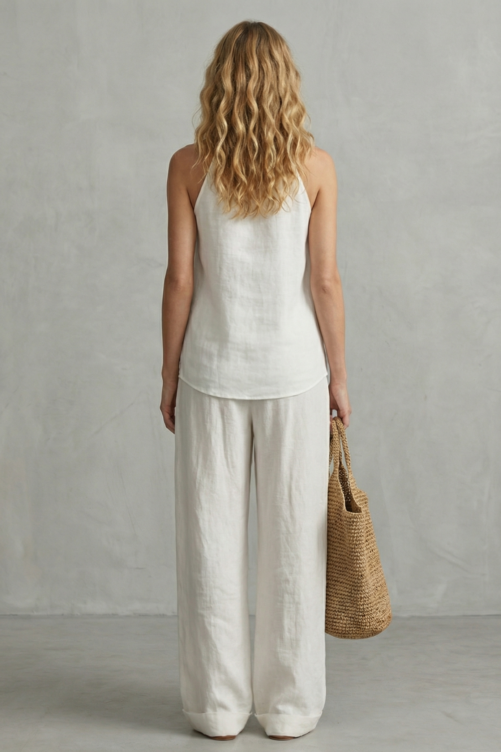 Detail close-up of the deep V neckline and soft drape of the top