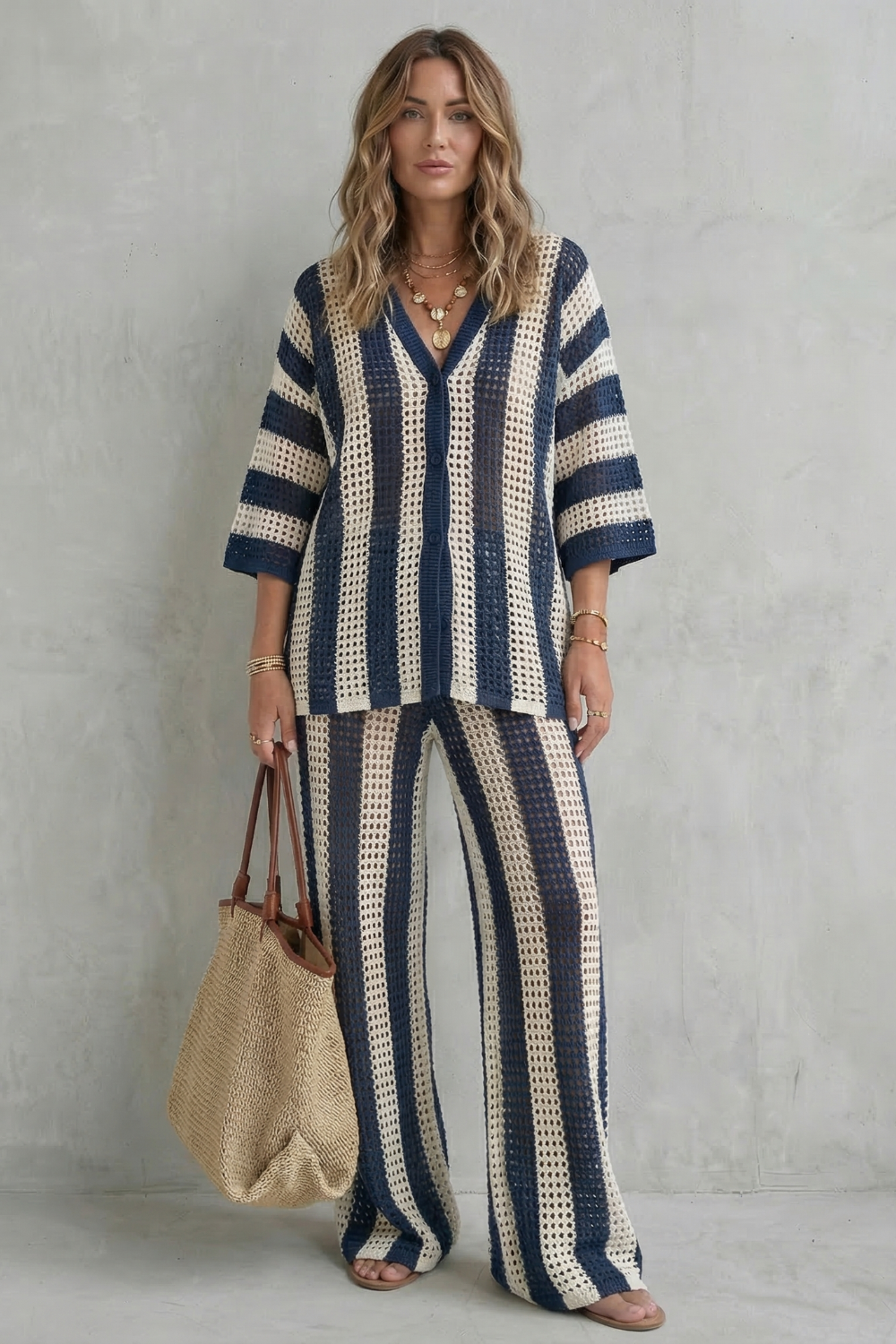 Dark Blue colorway of the striped knit co-ord styled with flat sandals