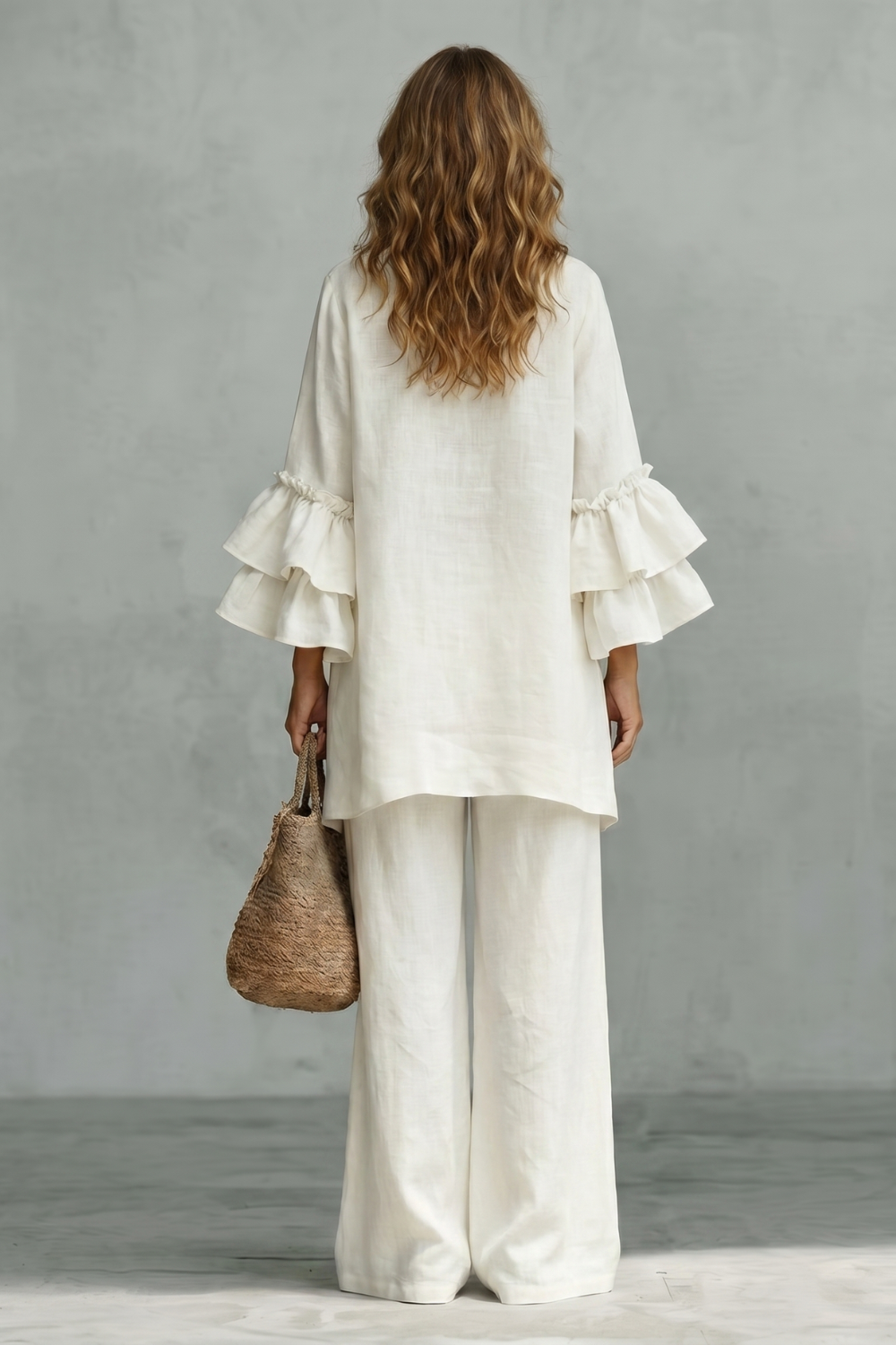 Detail close-up of the layered ruffle sleeves on the tunic top
