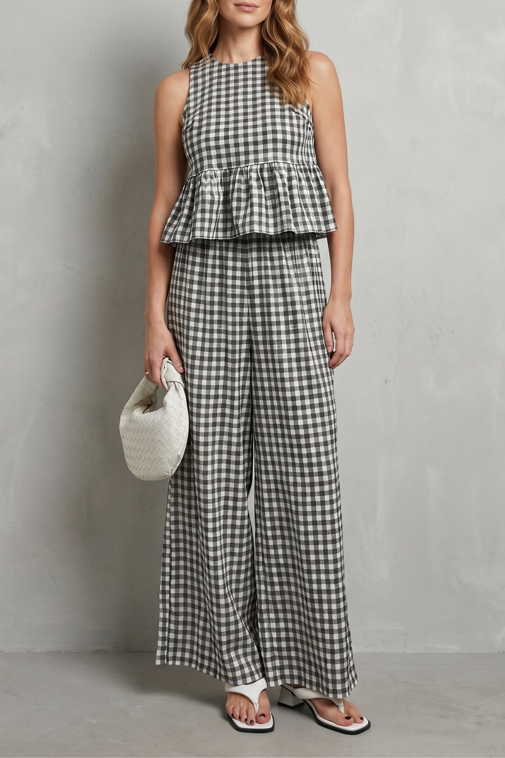 Women's sleeveless gingham ruffle top and wide-leg pants set, front view