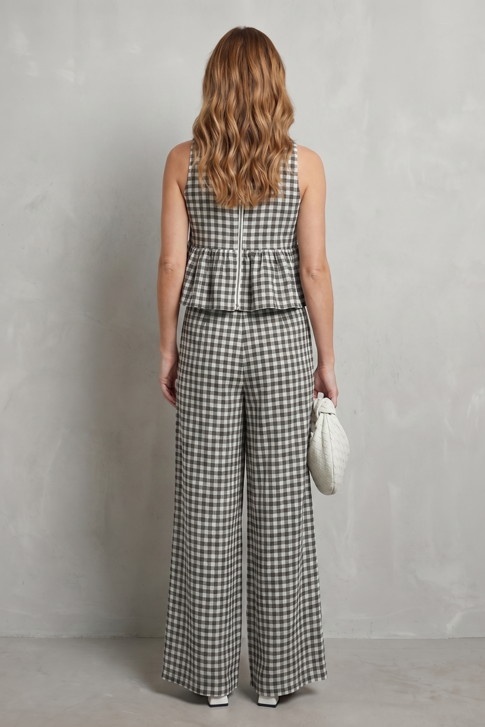 Detail close-up of the ruffle shoulder trim and gingham check