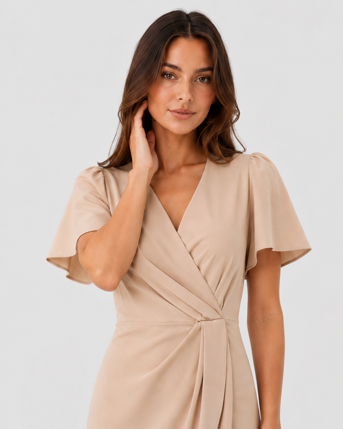 Woman wearing the Klyne Studios Z wrap dress with a V-neckline, flowing sleeves, and a relaxed fit, styled for an elegant party or evening occasion.