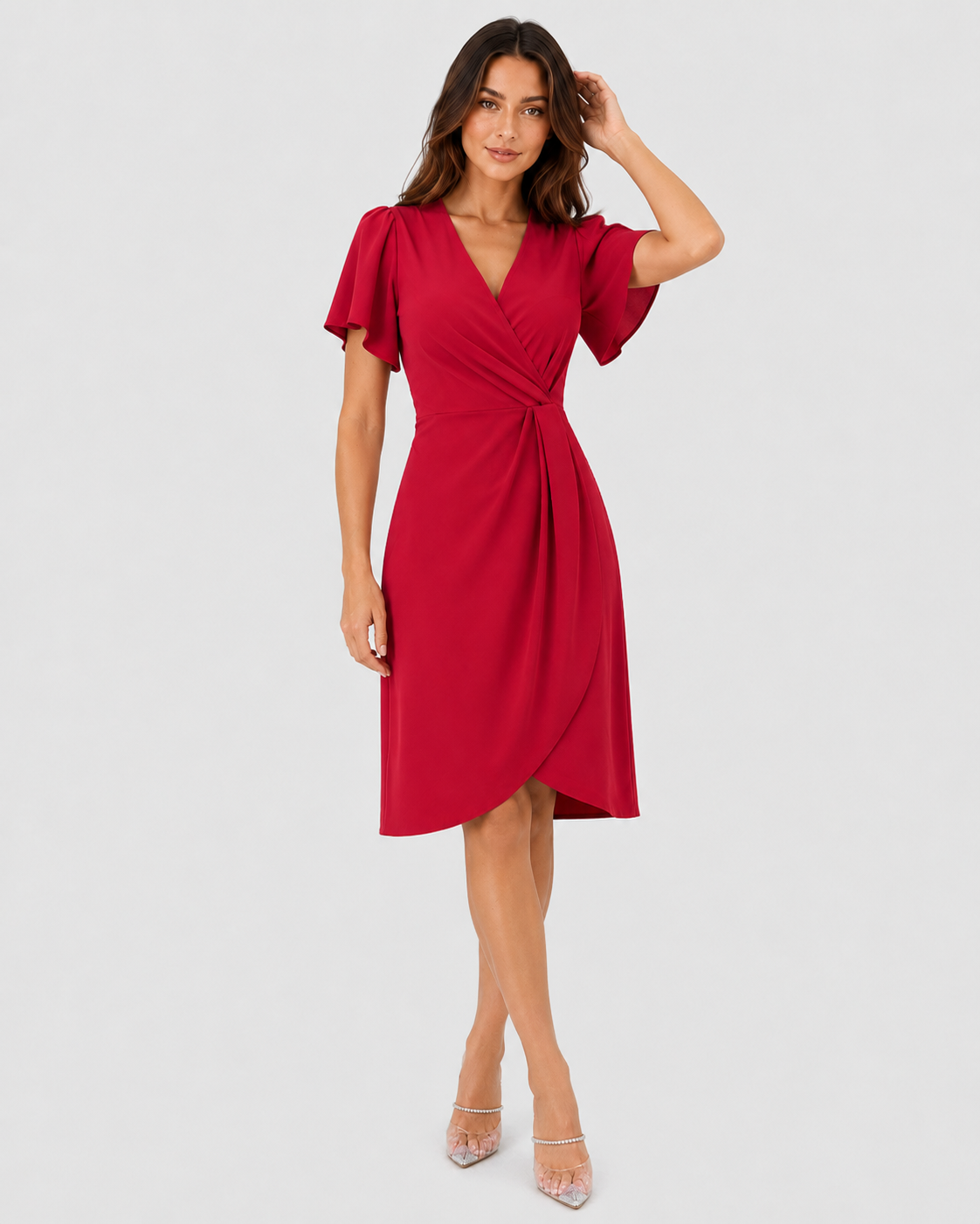 Woman wearing the Klyne Studios Z wrap dress with a V-neckline, flowing sleeves, and a relaxed fit, styled for an elegant party or evening occasion.