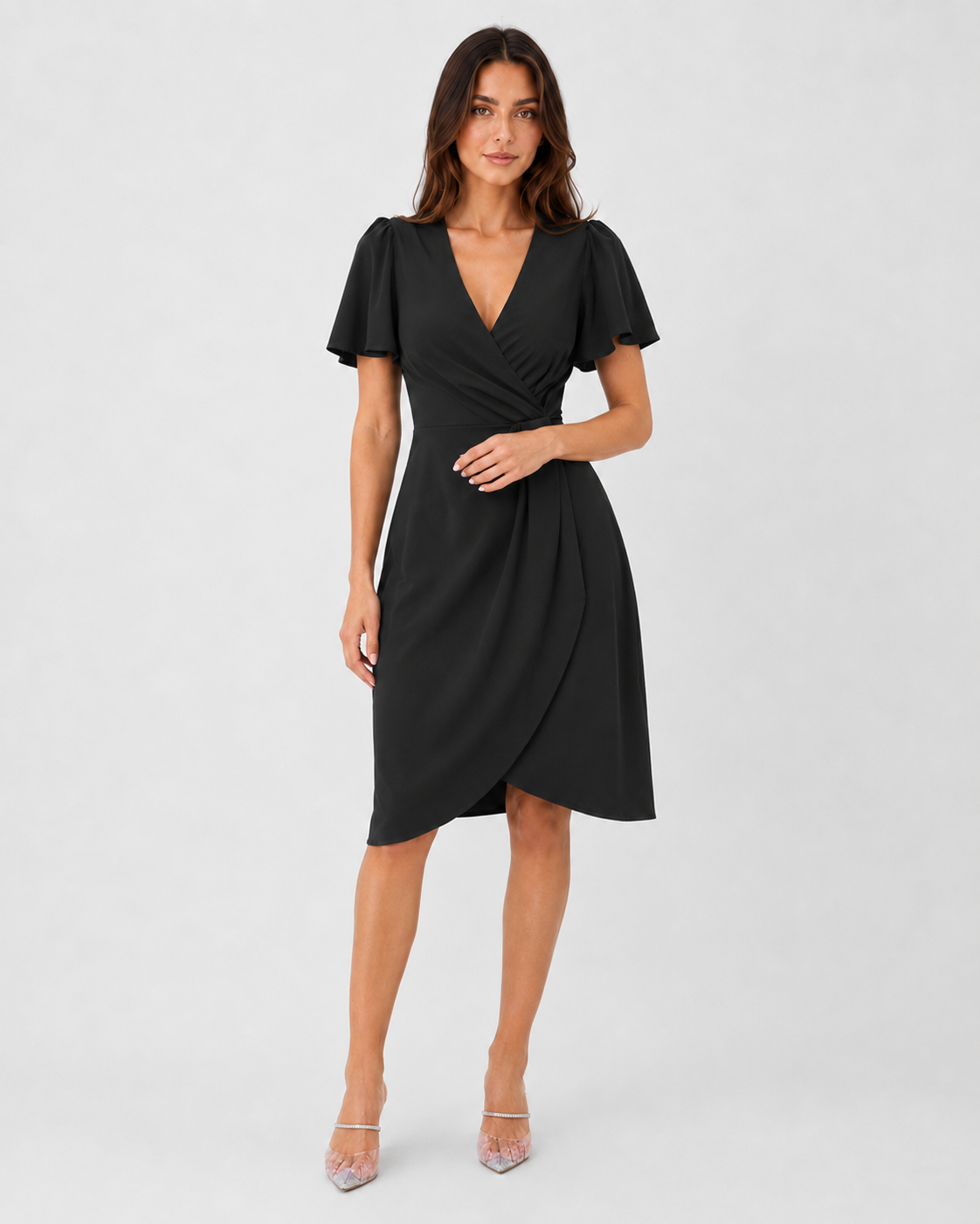 Woman wearing the Klyne Studios Z wrap dress with a V-neckline, flowing sleeves, and a relaxed fit, styled for an elegant party or evening occasion.