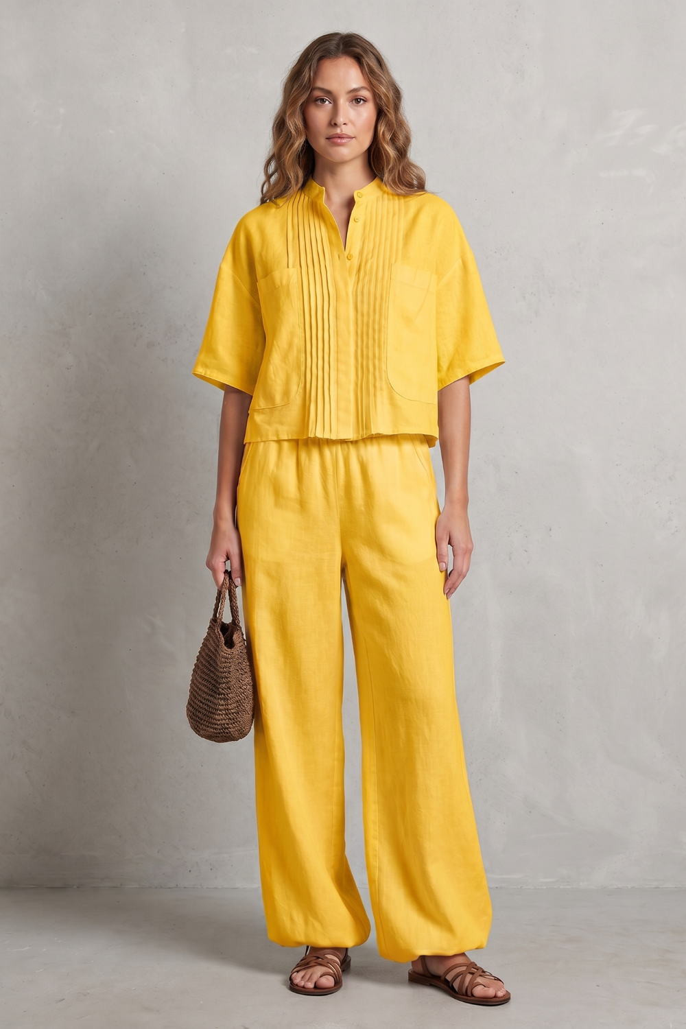 Black colorway of the pleated wide-leg pants set, full-length view
