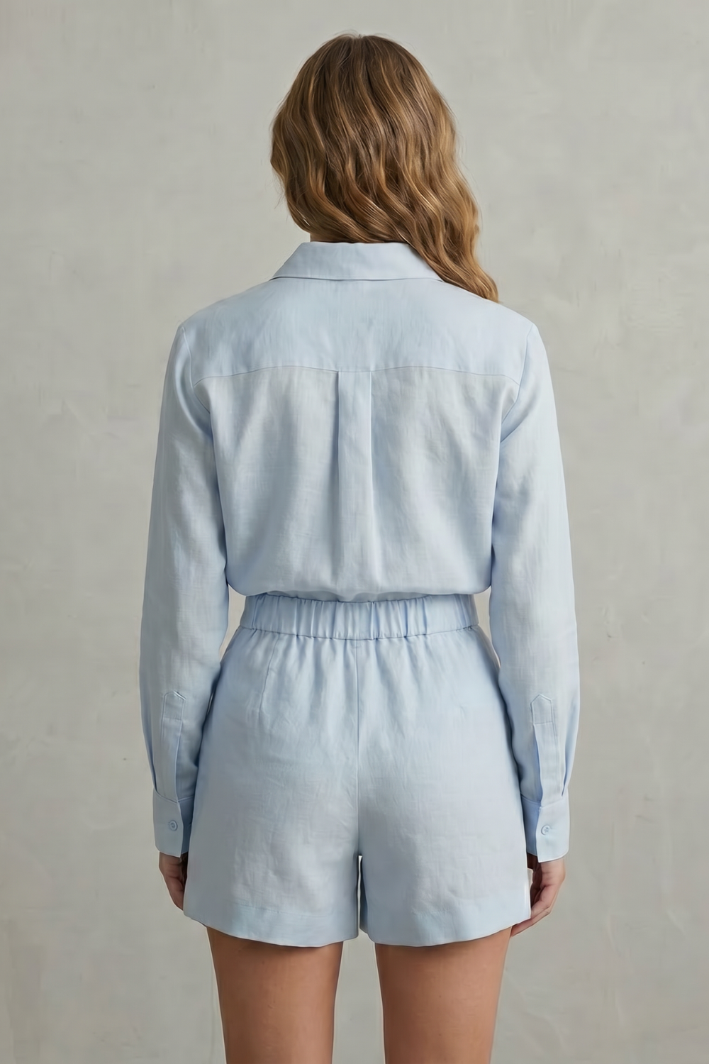 Detail close-up of the high-waisted tailored shorts and waistband