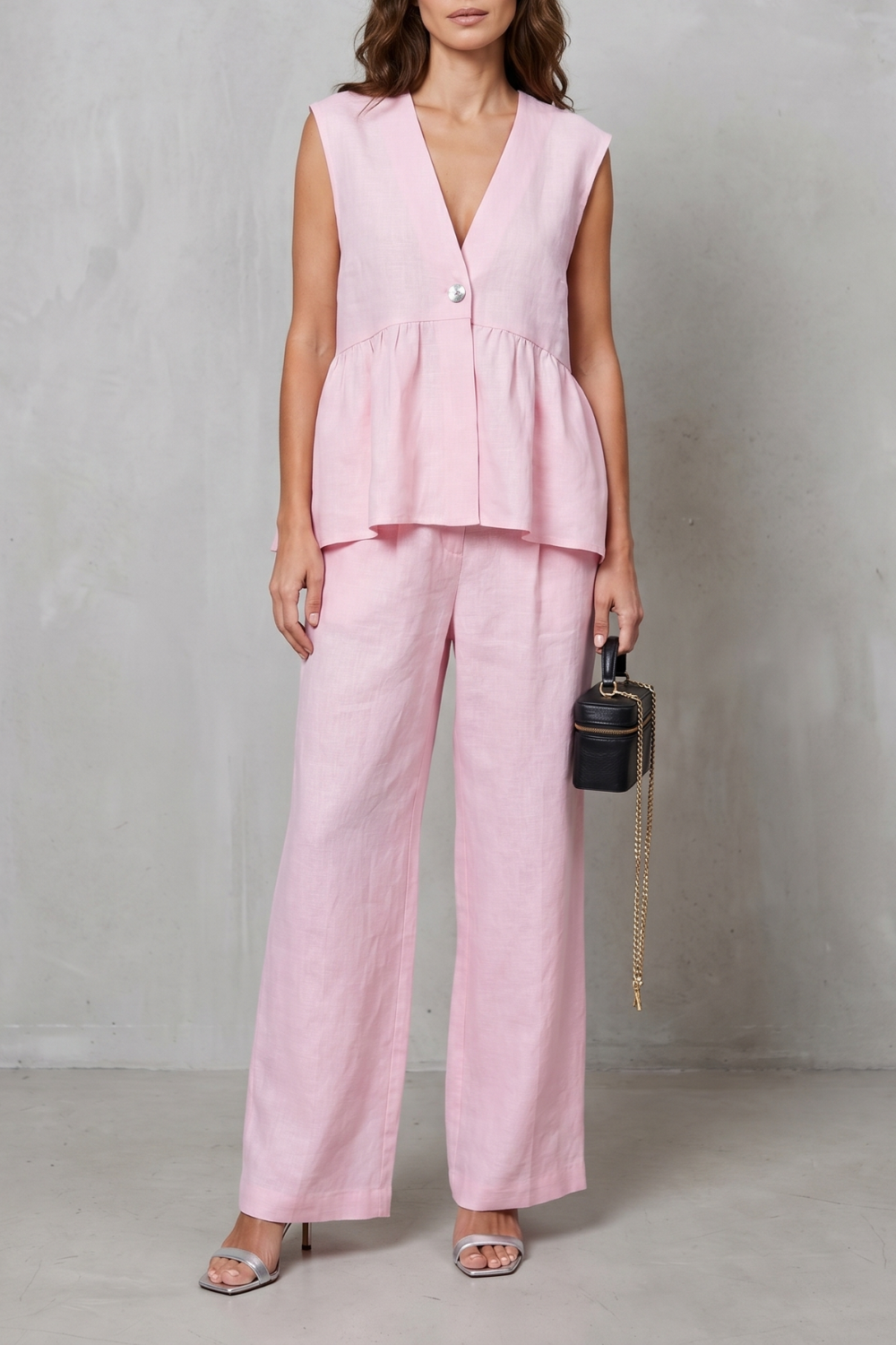 Women's sleeveless V-neck peplum top and wide-leg pants set, front view