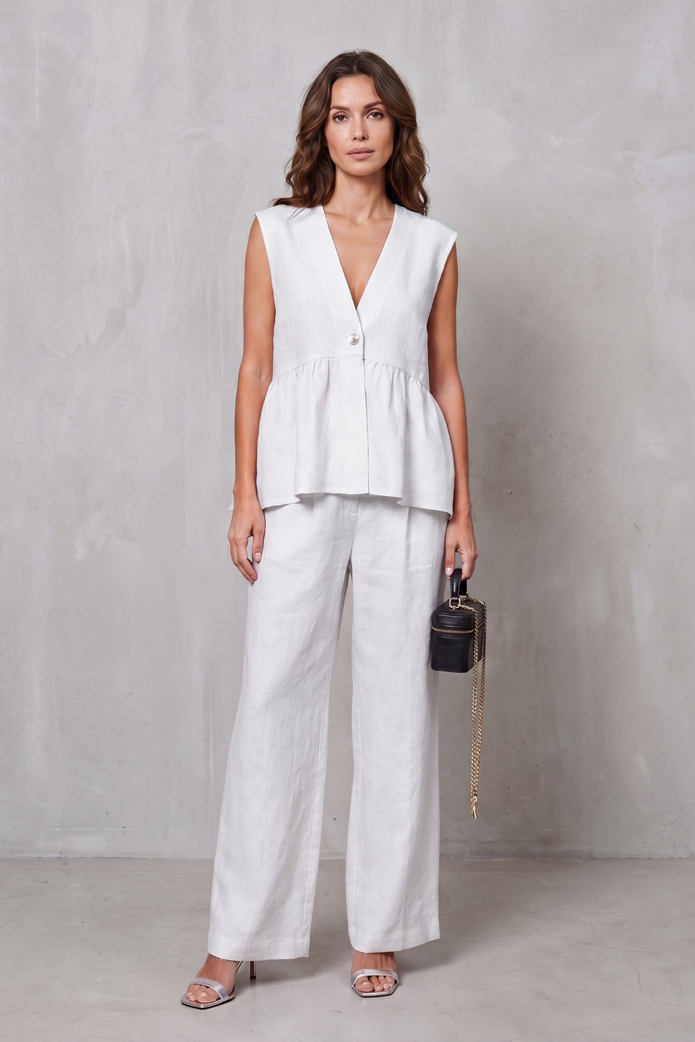 Detail close-up of the peplum waist flare on the top
