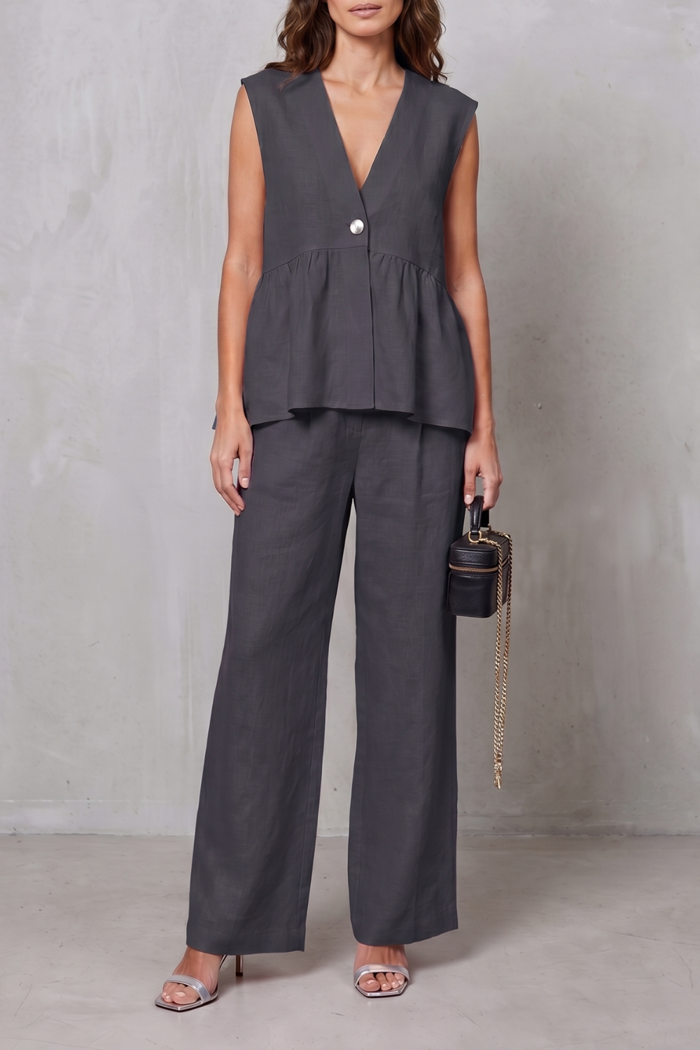 Pink colorway, full-length view of the peplum top and pants set