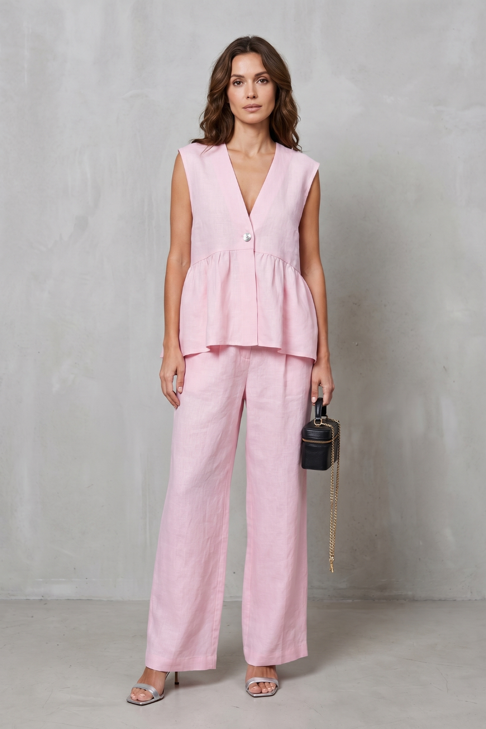Side view of the peplum top and wide-leg pants two-piece set