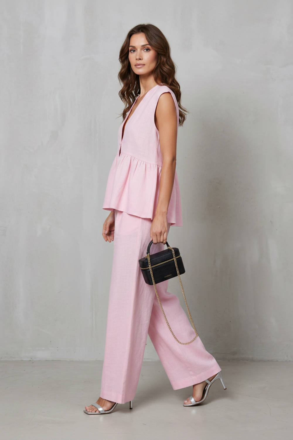 Back view of the sleeveless peplum top and wide-leg pants set