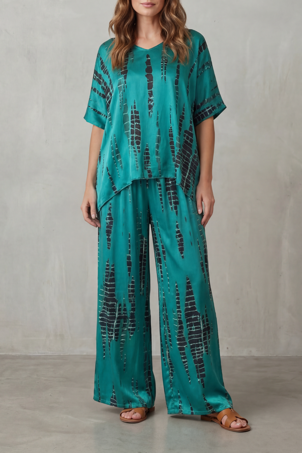 Close-up of the flowing wide-leg pants in the Marie lounge set