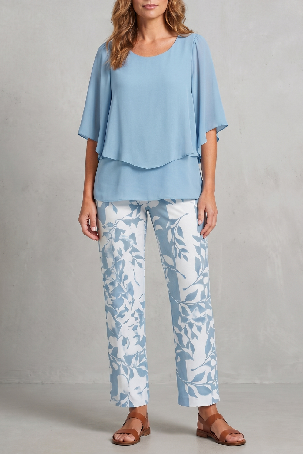 Detail of the flowing layered top showing its soft draped movement