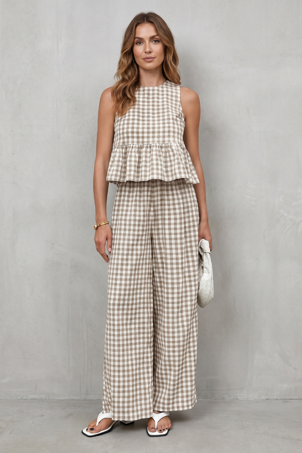 Side view of the gingham peplum top and wide-leg pants set