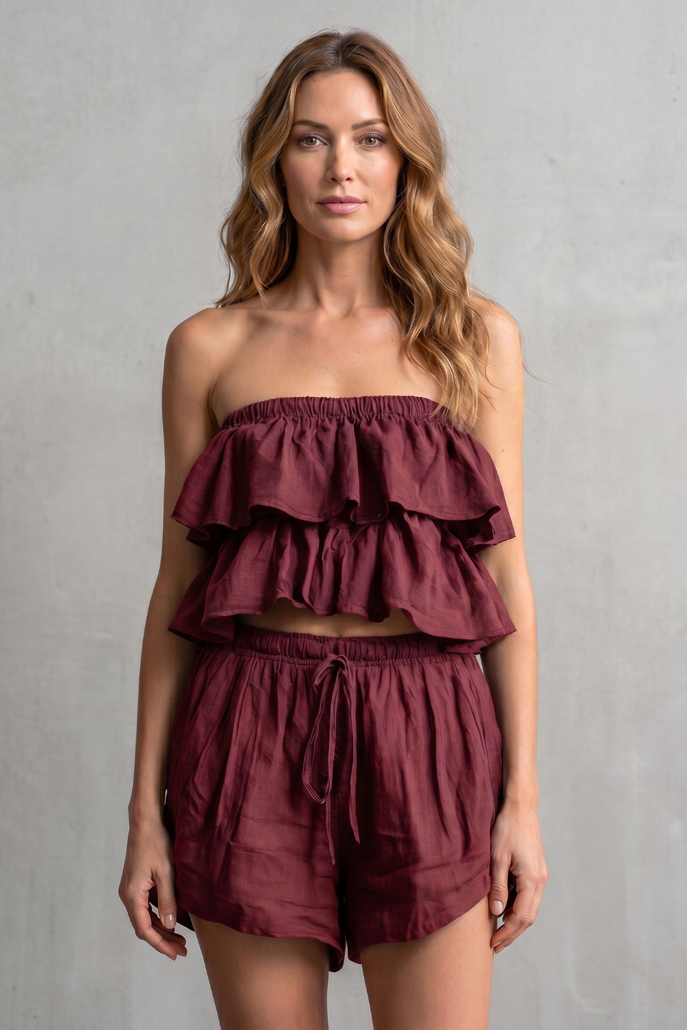 Ruffled shorts set styled with flat sandals and a woven tote