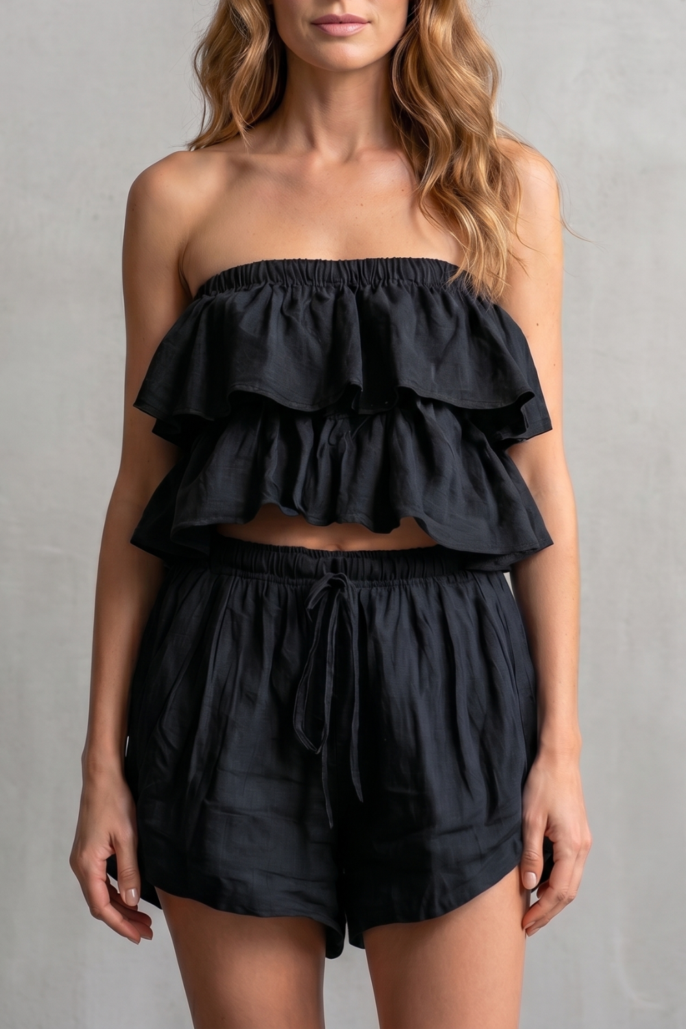 White colorway of the ruffled bandeau top and shorts set, full-length view