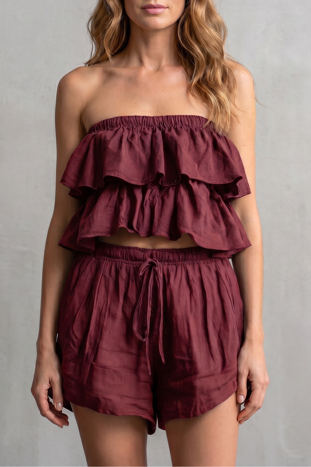 Wine Red colorway of the ruffled bandeau top and shorts set, full-length view