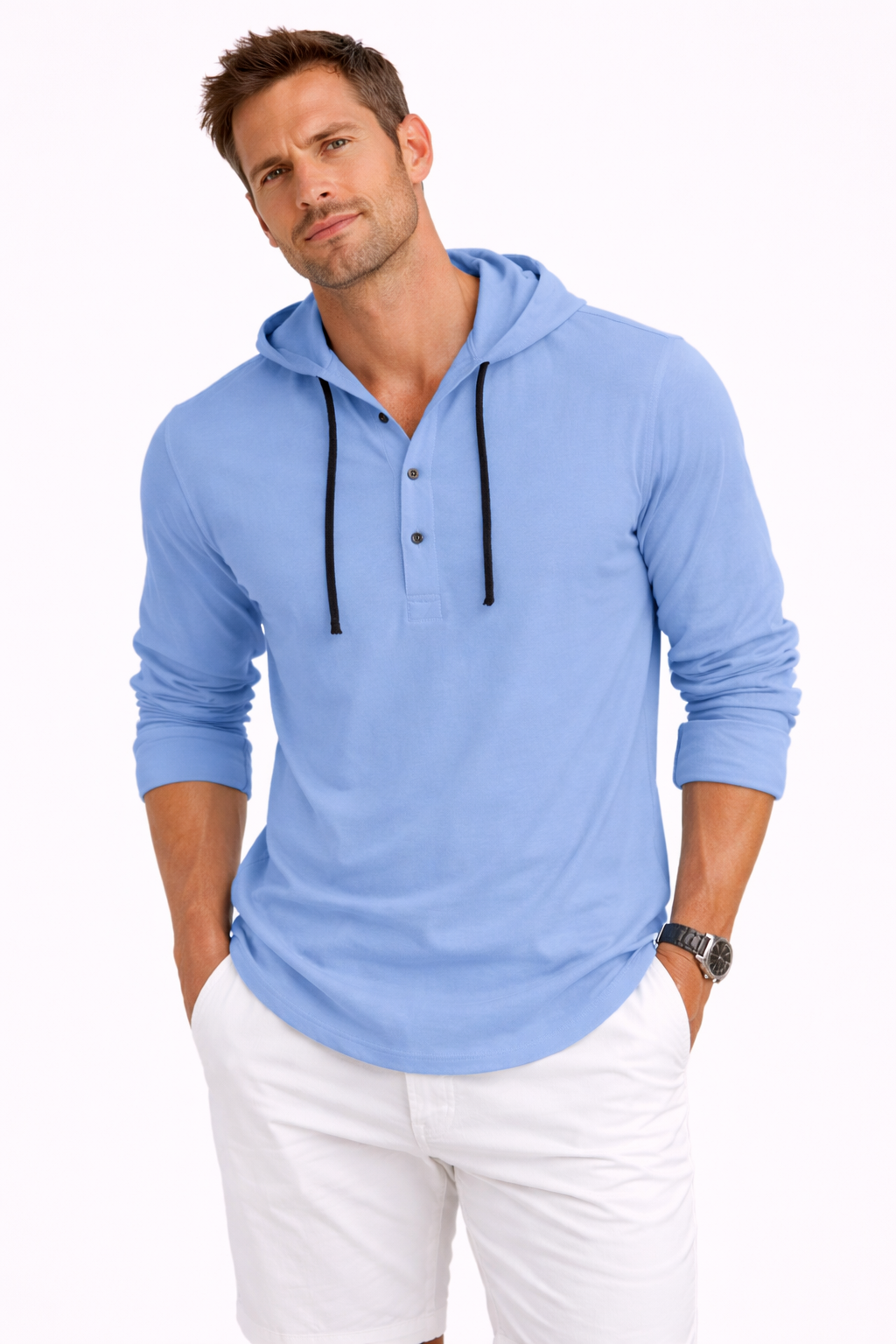 Man wearing a light blue hoodie and white pants on a white background