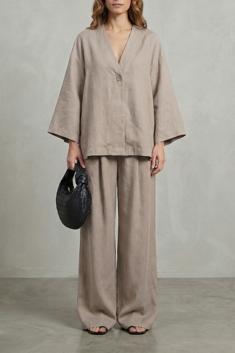 Detail close-up of the high-waisted waistband on the wide-leg pants