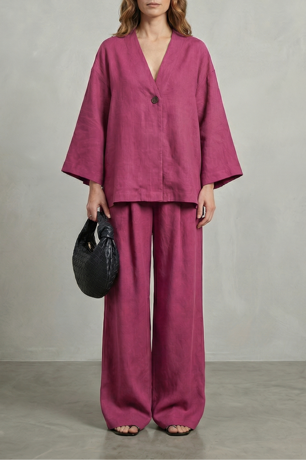 Navy colorway of the wrap V-neck top and wide-leg pants set, full-length view