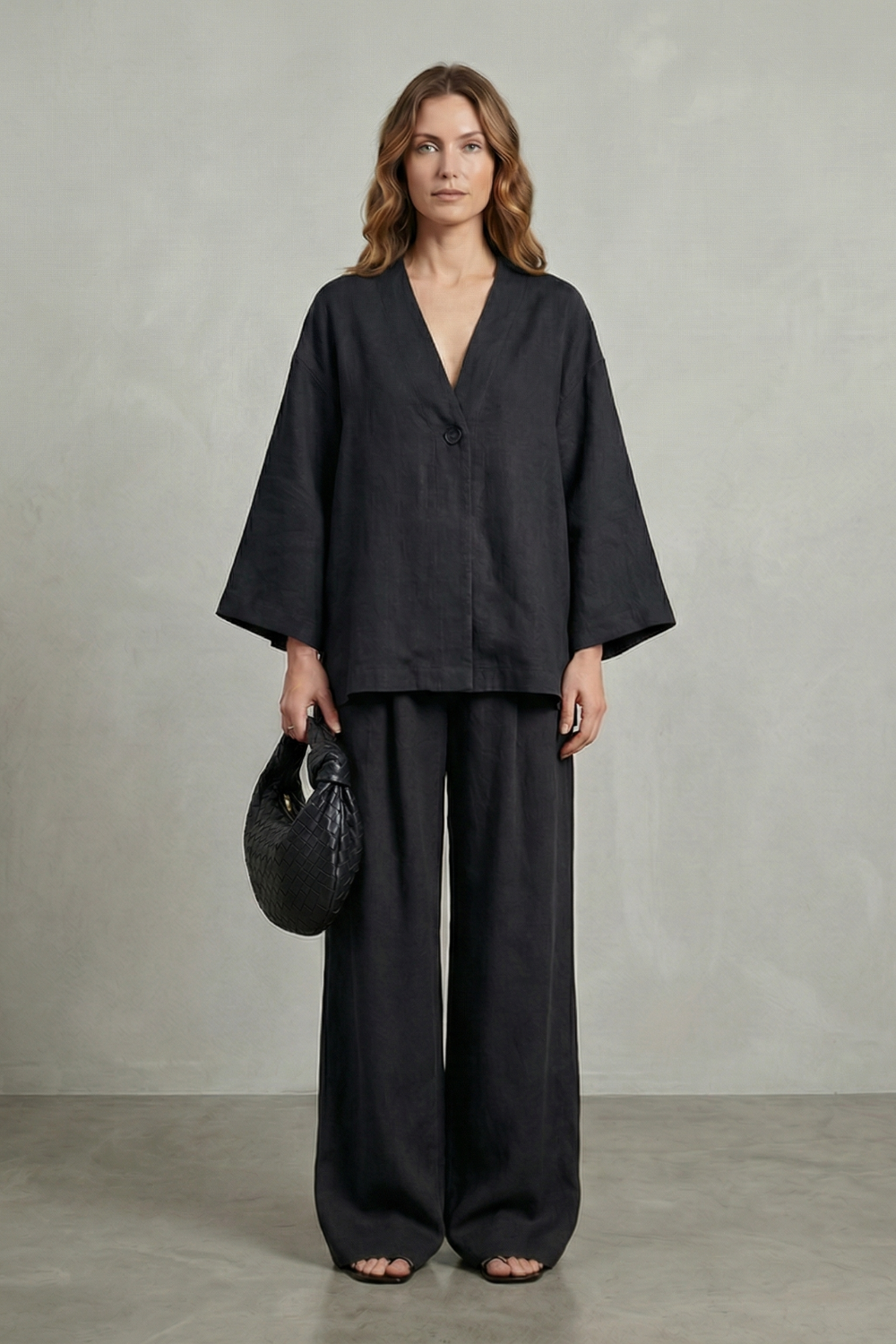 Blue colorway of the wrap top and wide-leg pants set, full-length view