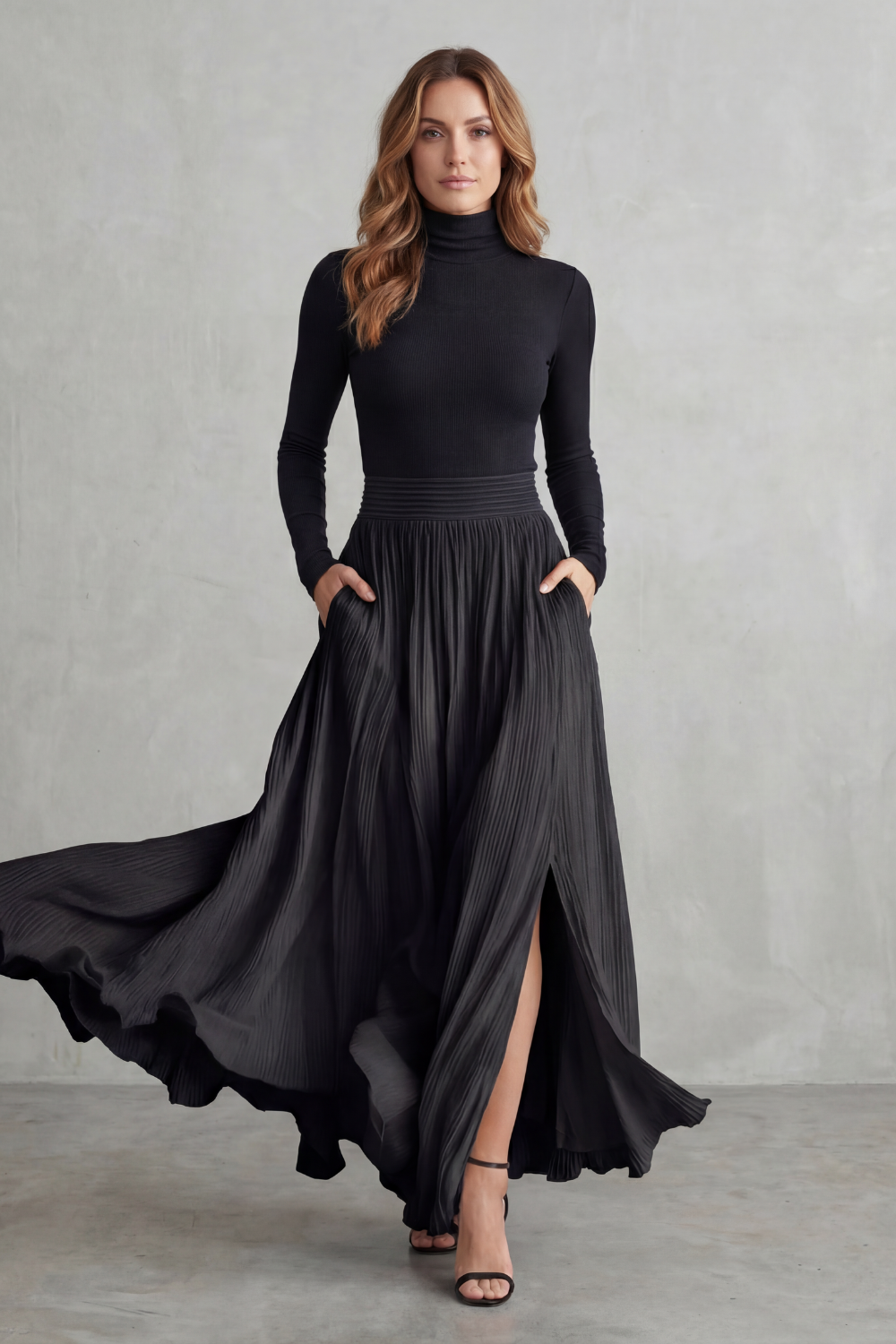 Side view of the fitted turtleneck and flowing pleated maxi skirt