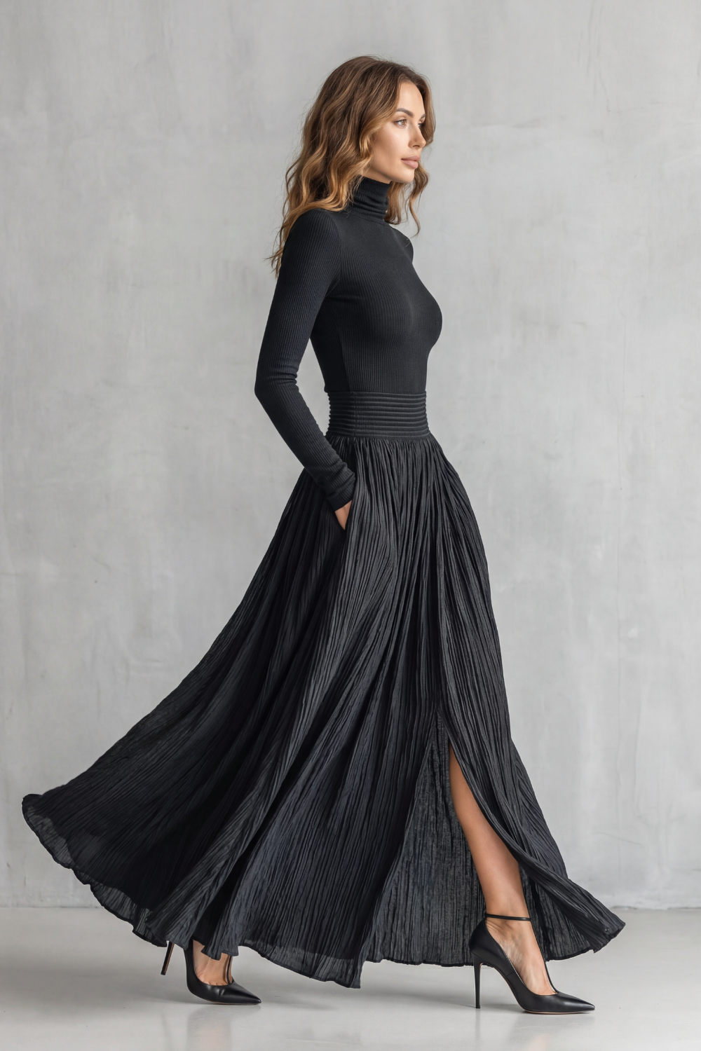 Back view of the two-piece turtleneck top and pleated maxi skirt set
