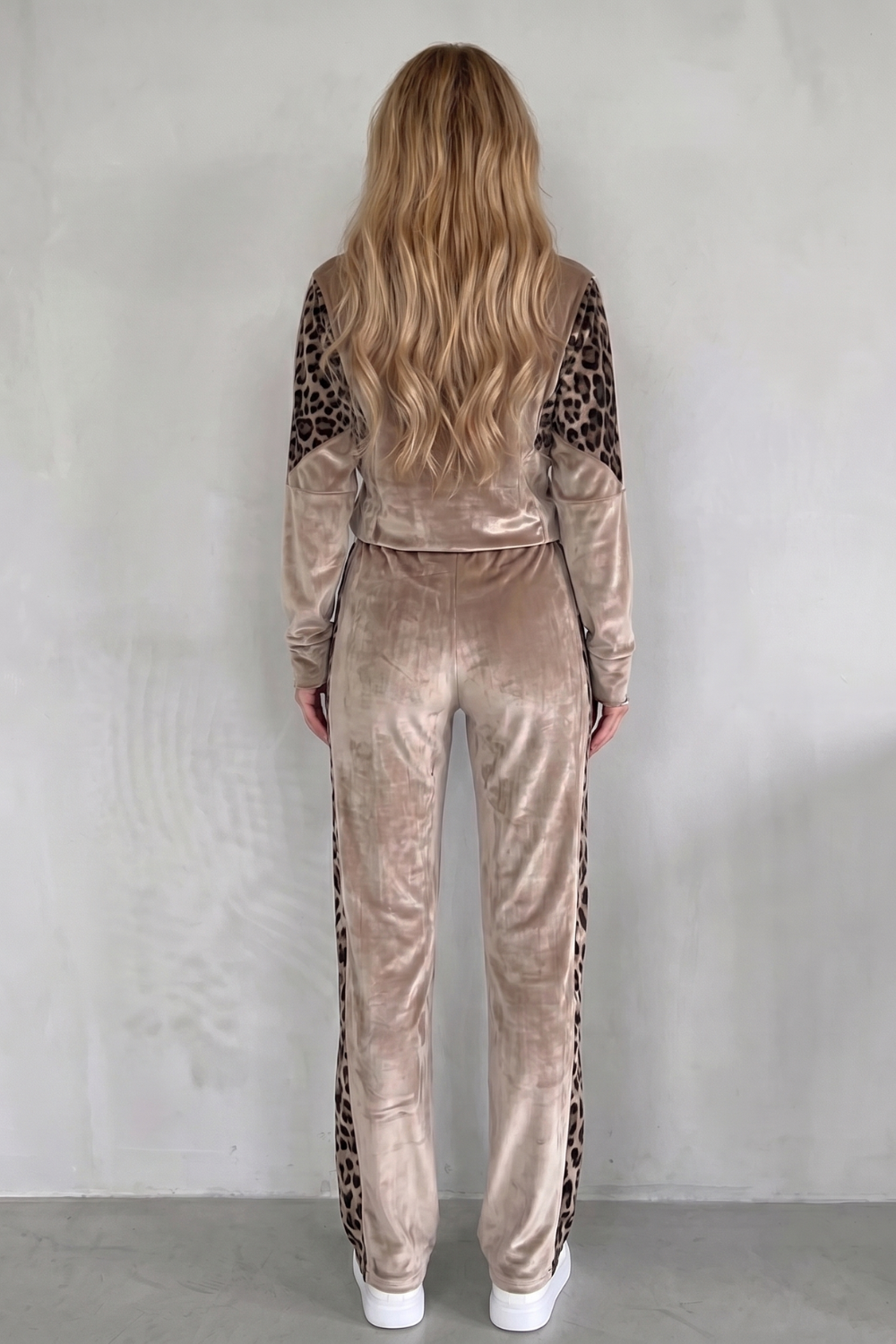 Detail close-up of the leopard print color-block panels on the zip-front jacket
