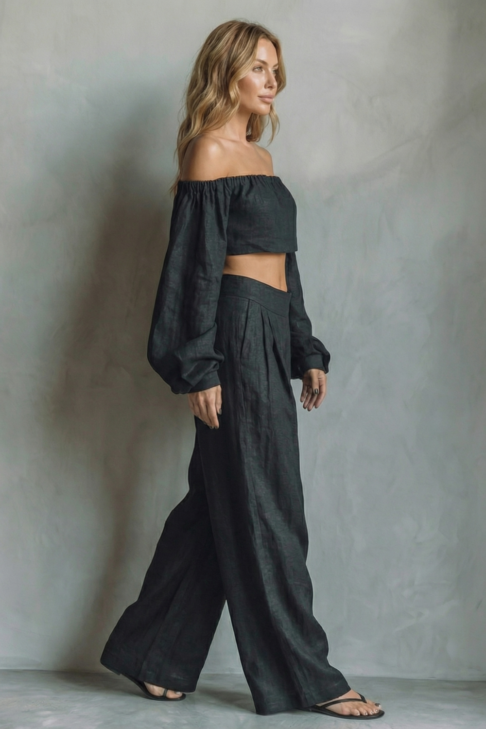 Back view of the black two-piece off-shoulder pants set