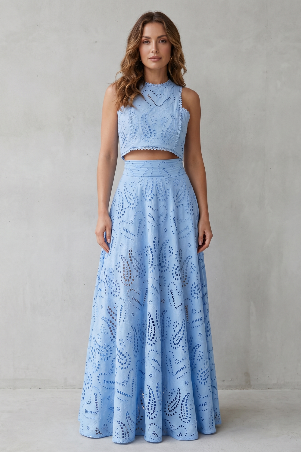 Side view of the sleeveless lace crop top and high-waisted midi skirt