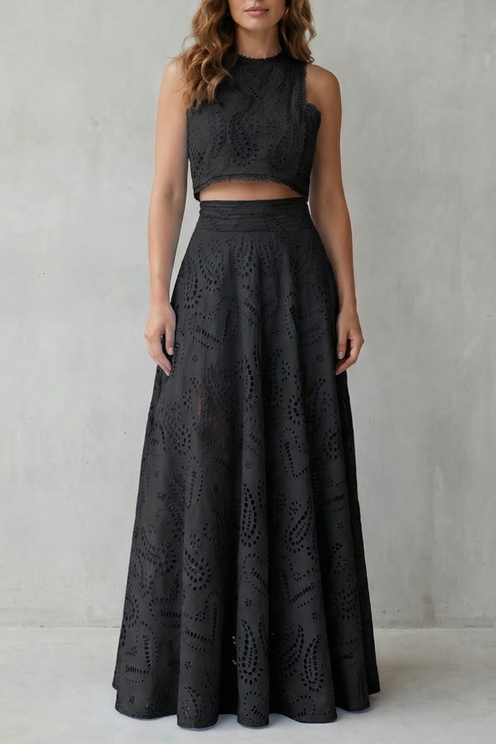 Three-quarter view showing the flowing drape of the lace midi skirt