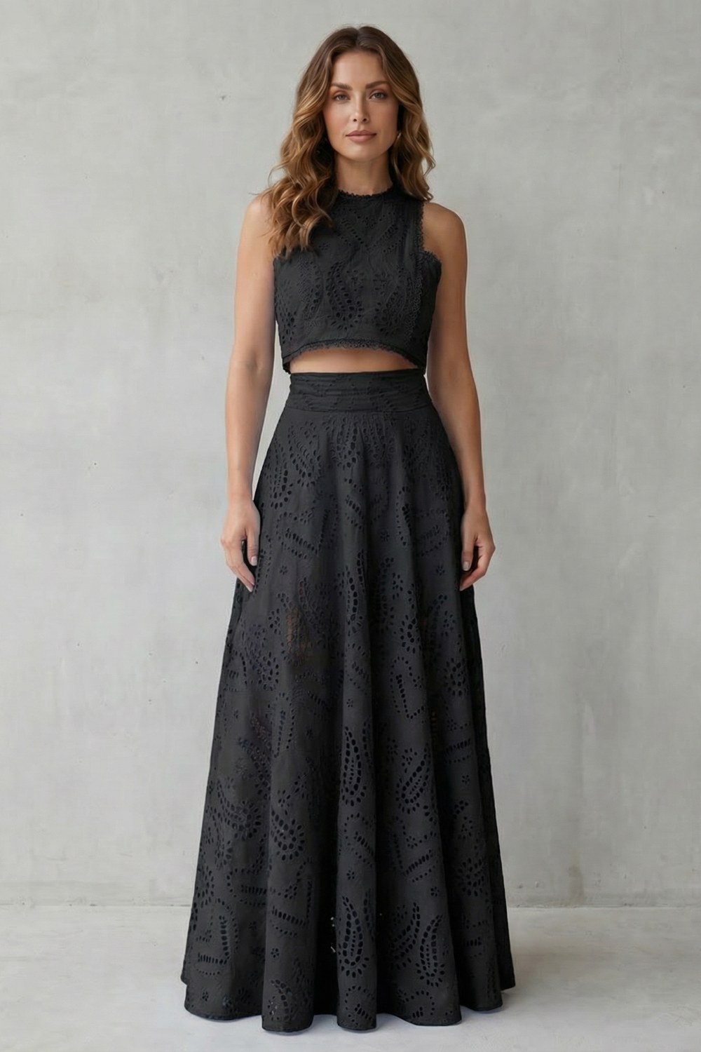 Lace crop top and midi skirt set styled with neutral heels and a mini bag