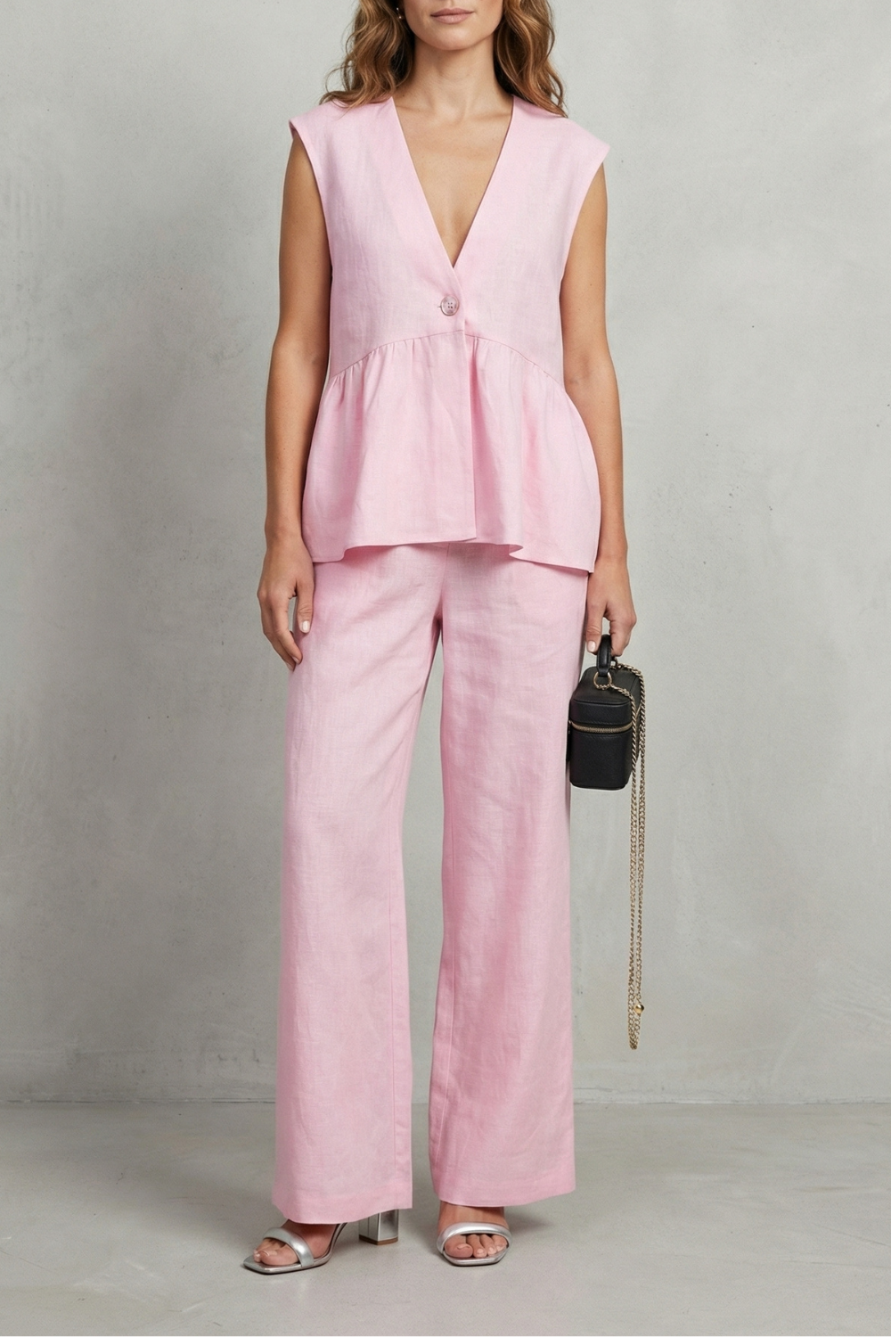 Women's sleeveless V-neck ruffle top and straight-leg pants set, front view